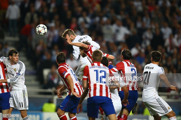 Sergio Ramos of Real Madrid heads the ball to score the equalizing goal during the UEFA Champions League Final between Real Madrid CF and Club Athletico de Madrid at Estadio da Luz in Lisbon, Portugal, on May 24, 2014. Photo: Manuel Blondeau/AOP.Press/Corbis