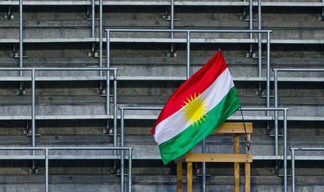 Kurdistan flag football stand Rojava revolution conflict